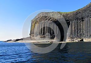 Volcanic island with basalt columns photo