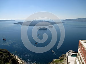 The volcanic island Nea Kameni view from Fira village of Santorini, Greece