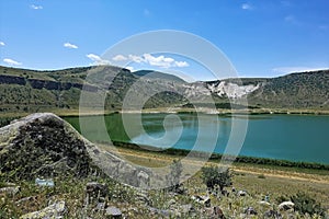 The volcanic Lake Nar is surrounded by mountains. photo
