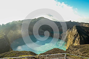 Volcanic lakes Ato Polo and Nuamuri koofai . National park Kelimutu. Kelimutu tri coloured volcano crater covered with photo