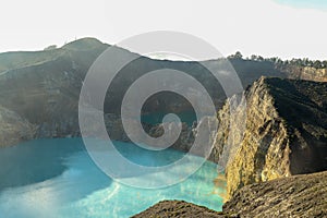 Volcanic lakes Ato Polo and Nuamuri koofai . National park Kelimutu. Kelimutu tri coloured volcano crater covered with photo