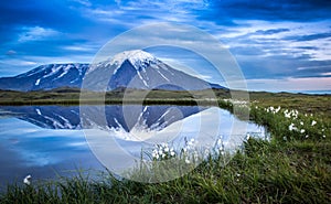 Volcanic land near Tolbachik views of sunrise reflection off a pond n