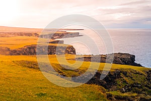 Volcanic landscape with green plains and rocky coast in Snaefellsnes peninsula, Iceland