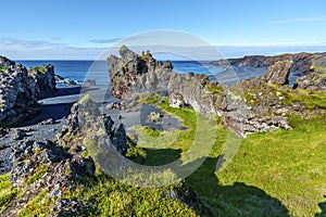 Volcanic lava rocks at Djupalonssandur beach situated on foot of Snaefellsnes peninsula in Western Iceland