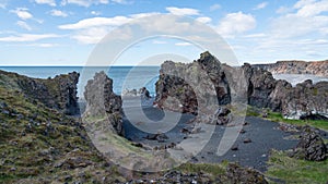 Volcanic lava rocks at Djupalonssandur beach in Snaefellsnes peninsula in Western Iceland