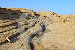 Volcanic layered flat rocks in the Bektau-Ata tract in sunset light