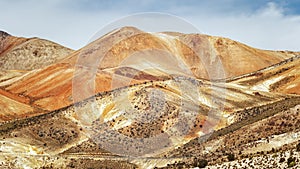 Volcanic multicolored mountains, near the town of Cariquima and photo