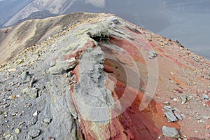 Volcanic red frozen lava, ash and sand on mountain range