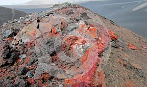 Volcanic red lava rocks in crater