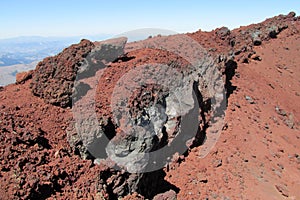 Volcanic red lava rocks in crater