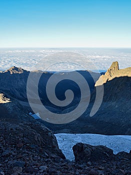 Volcanic rock formations above the clouds at Mount Kenya