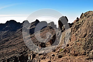 Volcanic rock formations above the clouds at Mount Kenya