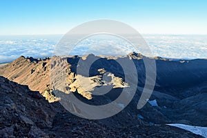 Volcanic rock formations above the clouds at Mount Kenya