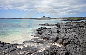 Volcanic rocks on a beach of uninhabited island, Galapagos National Park, Ecuador