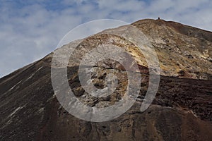 Volcano crater rim with person on top