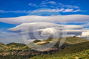 Volcano Etna covered by a lenticolar cloud, Sicily