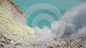 Volcano Ijen. View from above, stunning view of the Ijen volcano with the turquoise-coloured acidic crater lake. The