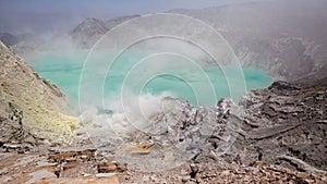 Volcano Ijen. View from above, stunning view of the Ijen volcano with the turquoise-coloured acidic crater lake. The