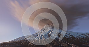 Volcano mountain with snow and clouds