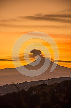 Volcano, mountains and forests in backlight photo