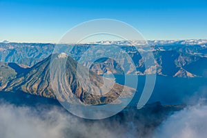 Volcano San Pedro at Lake Atitlan in highlands of Guatemala - Village Santiago and San Pedro you can see -  Aerial View