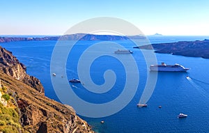 Volcano of Santorini island with ferry, Greece. Travel destination background, caldera view of Santorini nature. Ships and boats