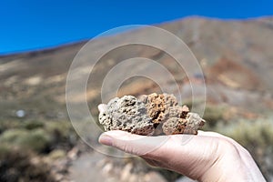 Volcano Stones in Hand, Volcanic Pumice with Glass, Pieces of Lava, Basalt Extrusive Igneous Rock photo