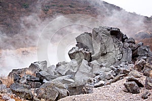 Volcano sulfur steam pit and rock photo