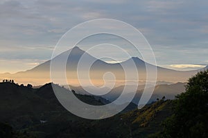 Volcanoes on the border of Uganda and Rwanda at dawn photo