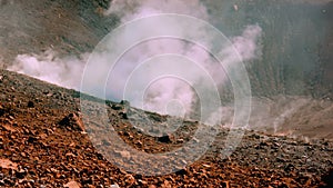 Volcanoâ€™s island fumarole releasing white steam