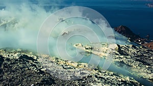 Volcanoâ€™s island fumarole releasing white steam