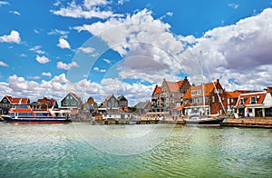 Volendam, Netherlands. High-speed motorboat by docks photo