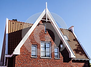 VOLENDAM, NETHERLANDS - JUNE 18, 2014: Traditional houses & streets in Holland town Volendam, Netherlands.