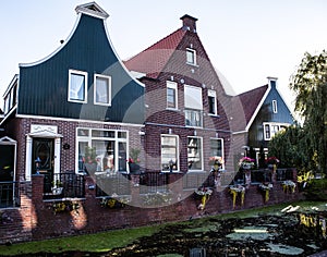 VOLENDAM, NETHERLANDS - JUNE 18, 2014: Traditional houses & streets in Holland town Volendam, Netherlands.