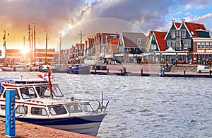 Volendam, Netherlands. Luxury yacht parked by pier on sunset