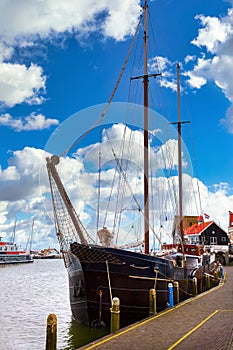 Volendam, Netherlands. Luxury yachts parked by pier photo