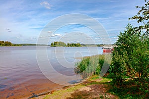 The Volga river near the city of Volgorechensk, Russia. The bank, overgrown with reeds, can be seen in the background of river