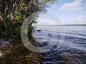 Volga river.  View of river stones on a sunny day with waves