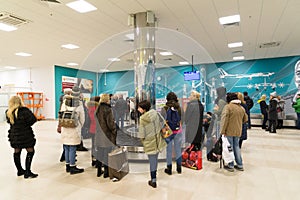 Volgograd, Russia - October 31.2016. Passengers await the luggage around baggage carousel in C terminalan of Aeroport