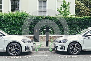 Volkswagen Golf GTE charging at a charging point on a street in London