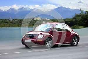 Volkswagen small red car.