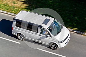 Volkswagen Transporter T5 TDI California with camper awning with motion blur effect