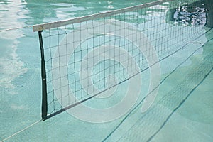 Volley net above swimming pool