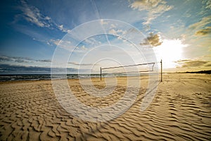 Volleyball court on the beach in sunset