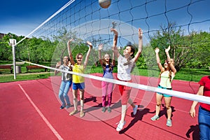 Volleyball game view with teenagers who play