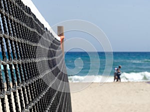 volleyball net on the beach with a clean sky