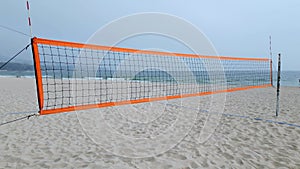 Volleyball Net on Beach by Ocean