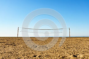 Volleyball net on sandy beach