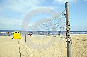 Volleyball net sea waste bin boat people relax