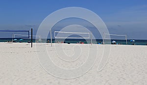Volleyball nets set under sunny skies, ready for NCAA beach volley ball tournament, Orange Beach, Alabama, 2018